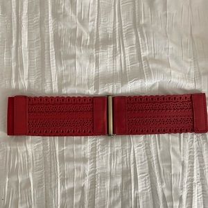 Red leather stretch belt. Size Med/Large
